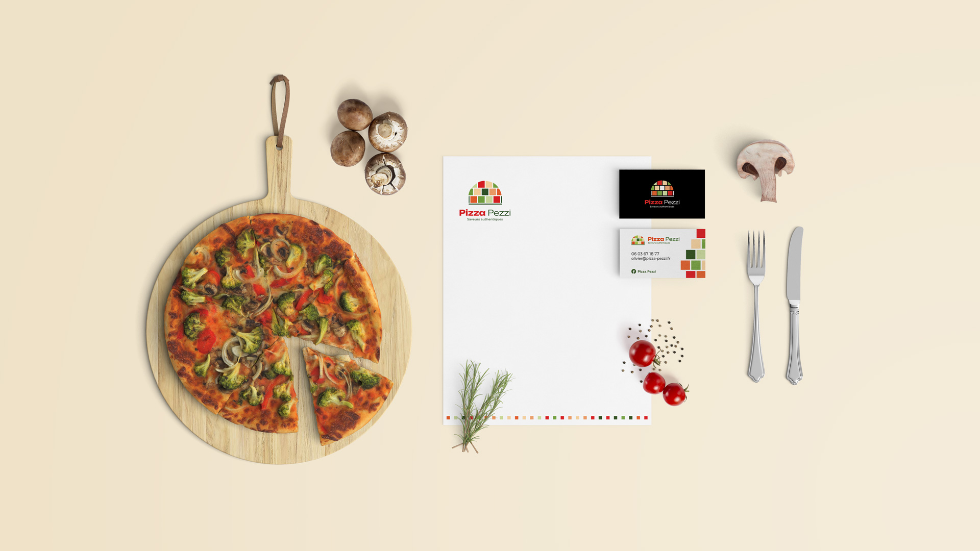 mise en scène du logo pizza pezzi sur des éléments de papeterie avec une pizza
